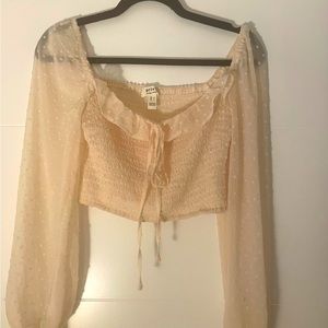 Light pink, long sleeve, crop top. Size small.